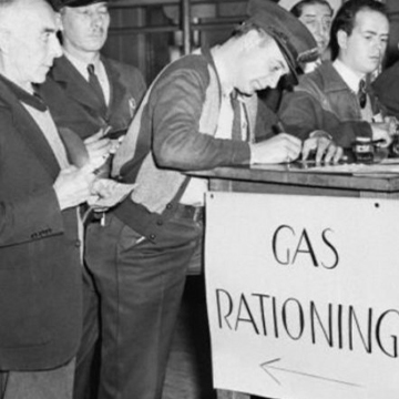 Men line up to sign in for rationed gasoline during 1942. Men line up to sign in for rationed gasoline during 1942.