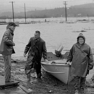 People leave a boat during massive flooding on the north coast of California in 1964. People leave a boat during massive flooding on the north coast of California in 1964.